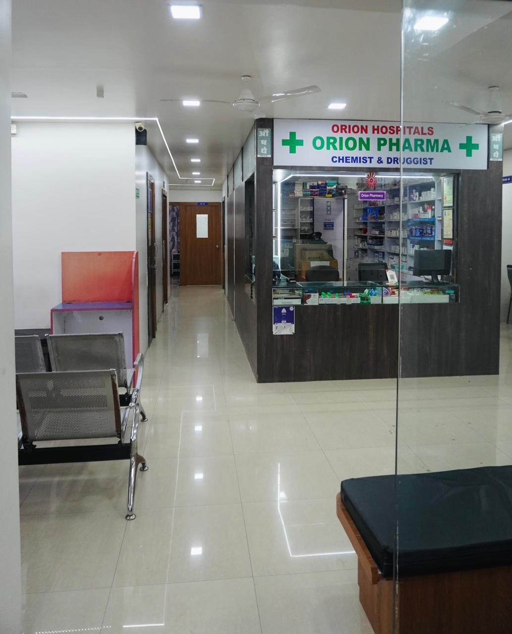 Hospital corridor leading to pharmacy at Orion Hospital